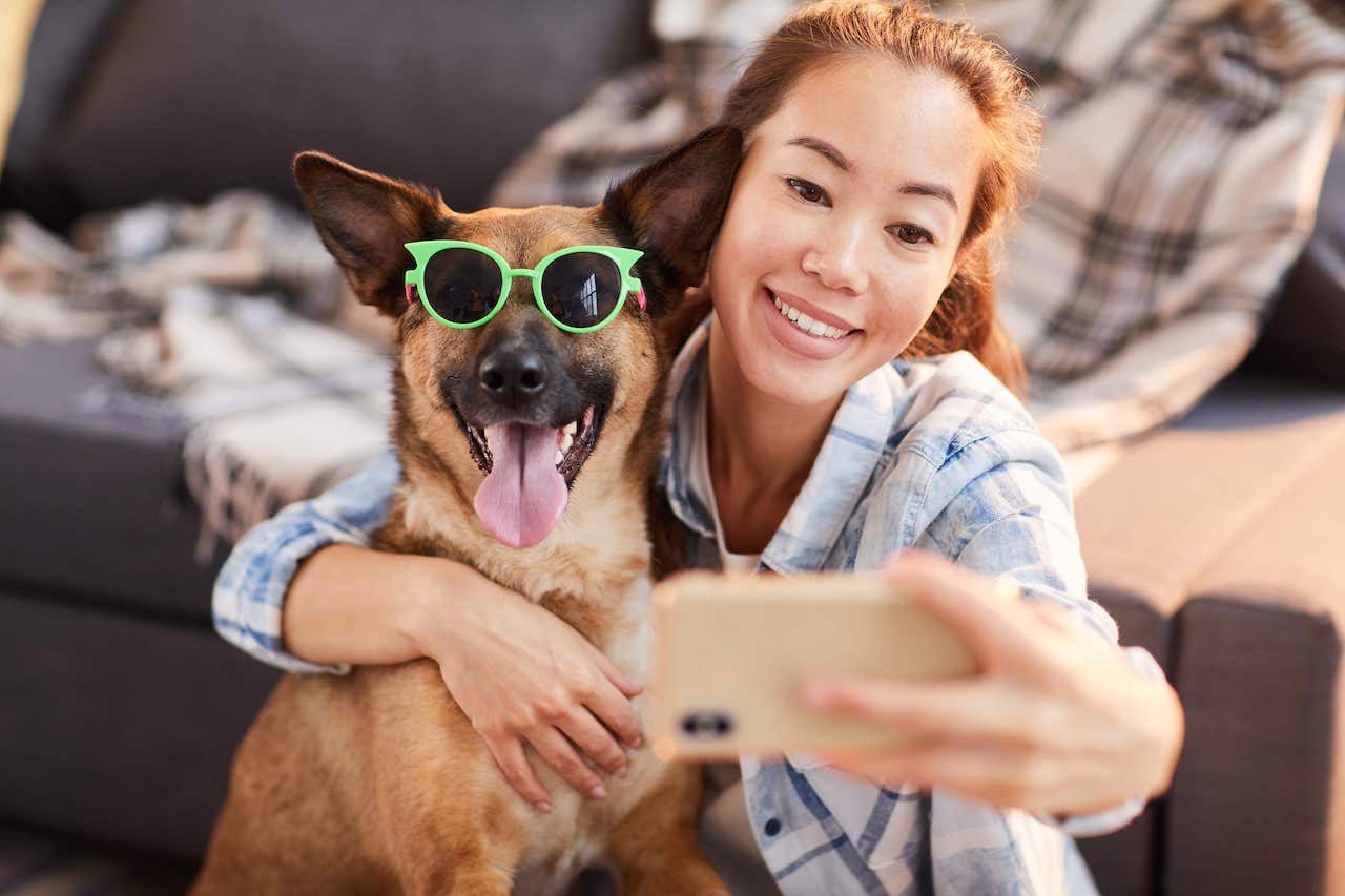 Take owners. People selfie with Dog.
