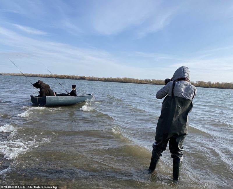 The woman and her rescued brown bear love to go fishing together