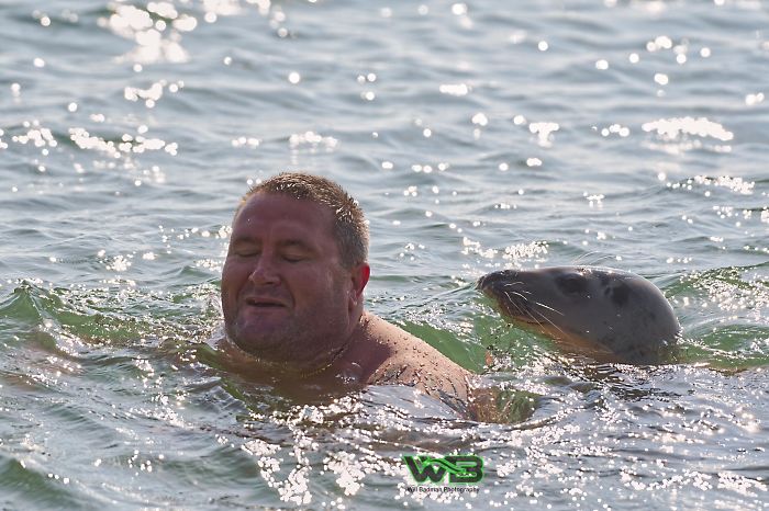 Sammy Sail is very outgoing, he is making human friends on the beach.